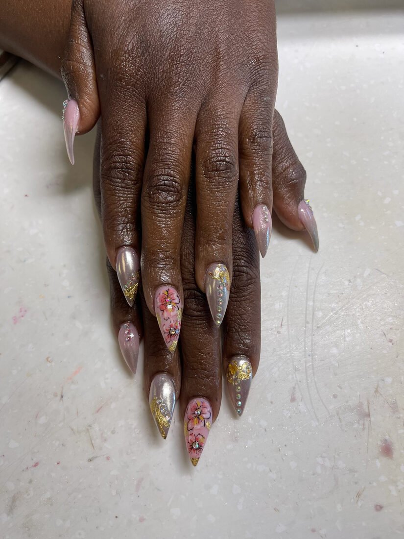 Long stiletto set in soft pink with gold foil flakes and rhinestone detail